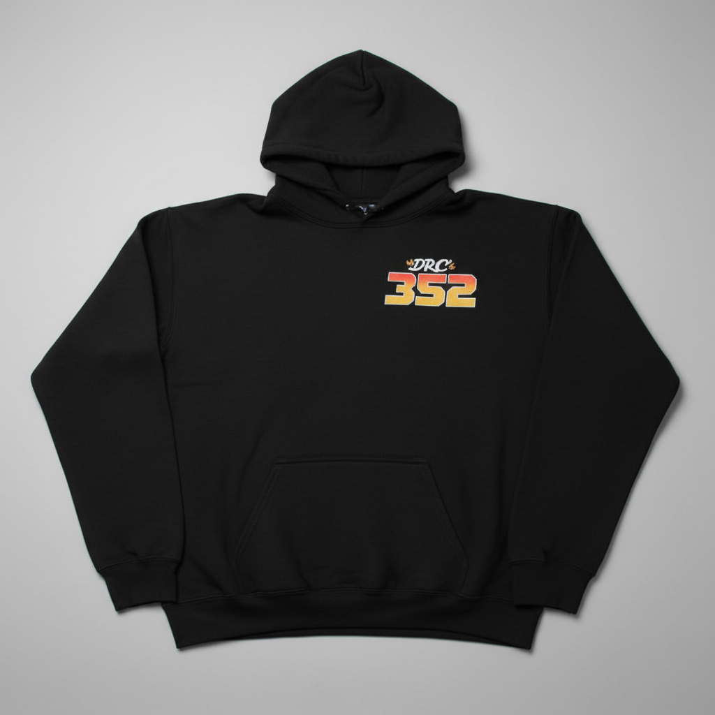 Black hoodie with 'DRC 352' logo on a beige surface